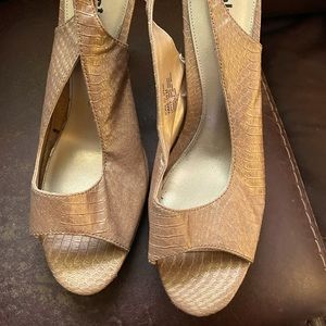 Gold sling back high heel shoes